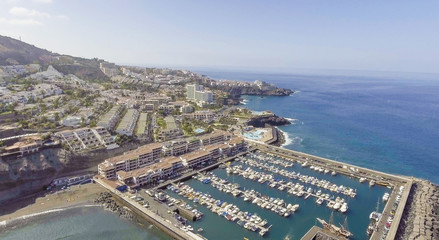 Fototapeta na wymiar Aerial coastal view of port and small boats