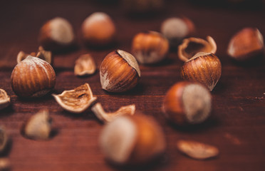 Still life with hazelnuts on a wooden background