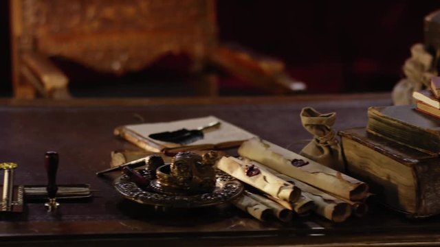 Historical pirate stuff on a old wooden table of a captain