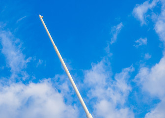 White flagstaff blue sky