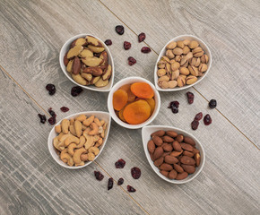Mixed Nuts and Dried Fruit on a Wooden Table