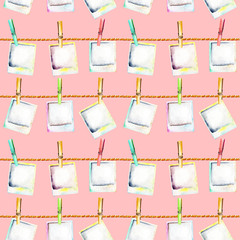 Seamless pattern with watercolor polaroid snapshots attached with clothespins to the ropes, hand drawn isolated on a pink background