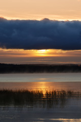 Sunrise over round lake
