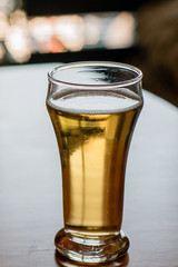 Pale ale on a bar table indoors