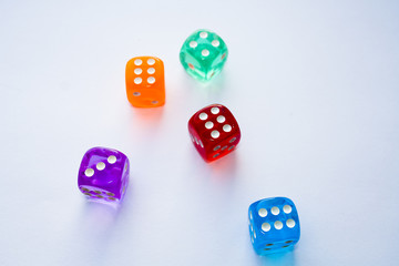 Hexagonal colored dice on a white background