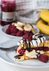 Belgian waffles on white plate and white background.