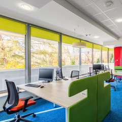 Colorful corporate interior with desks