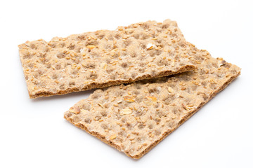 Stack of wholegrain crispy bread with sunflower, chia and sesames seeds