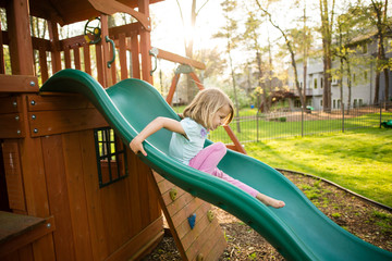 Girl sliding down slide