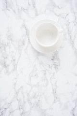 Obraz na płótnie Canvas Empty white cup on a white marble table