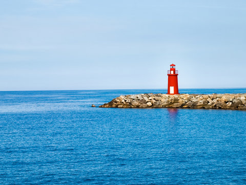 Red lighthouse at the port of entry reporting