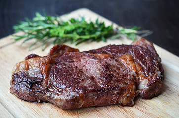 Grilled steak on cutting board