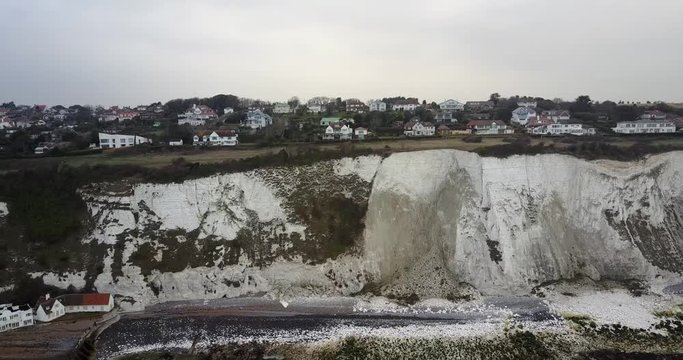 Flying away from white cliffs of Dover in Kent aerial shot