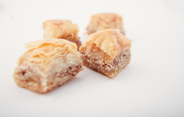 Arabian Eid dates sweets isolated. Oriental sweets with honey and nuts. Turkish Pakhlava Isolated On White. Turkish dessert.