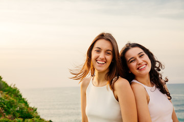 Laughing friends on a cliff