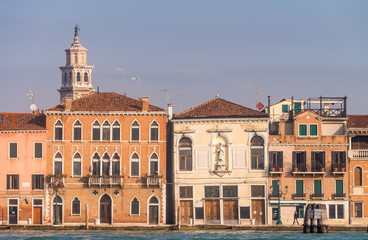 Fototapeta na wymiar VENICE, ITALY - FEBRUARY 8, 2015: City architecture on a sunny day. Venice is a famous destination in Italy