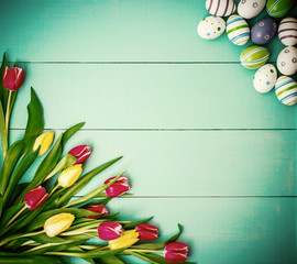 Tulips with colorful Easter eggs