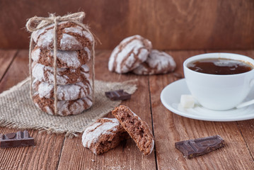 Homemade oat cookies with chocolate on a wooden background