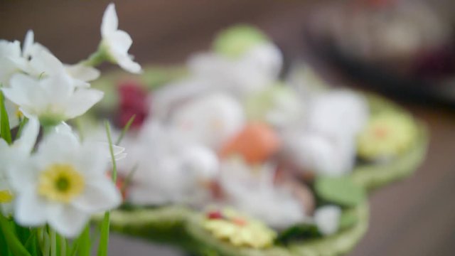 Easter eggs in a green basket with birdies.Easter decoration.Video rotation