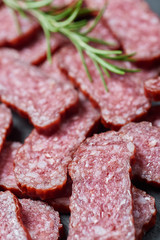 Sliced salami on a stone board