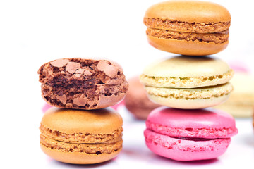 Colorful french macaroons on a white background