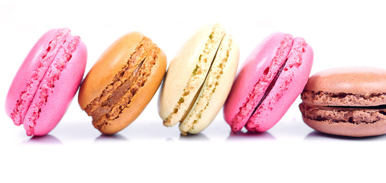 Colorful french macaroons on a white background