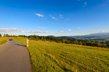 Fototapeta premium A road in mountain at warm summer light. Pieniny , Poland.