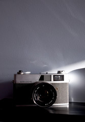 film camera with shadows on the wall