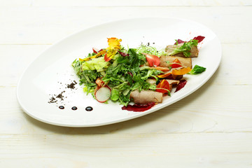 Green salad with baked meat
