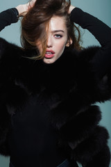 pretty sexy woman or girl with long hair in fur