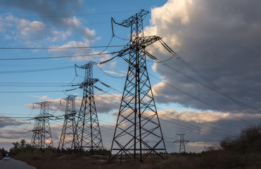   power lines. high voltage electric transmission tower at sunset.