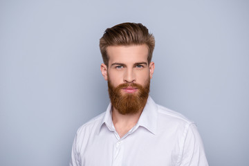 Portrait of confident bearded man in white shirt