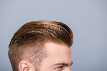 Obraz premium Cropped photo portrait of man's head with health hair and stylish haircut
