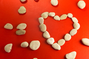 red heart with white stones