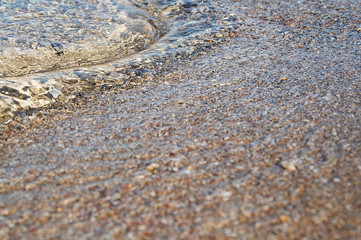 Fototapeta na wymiar Sea wave on a sandy beach
