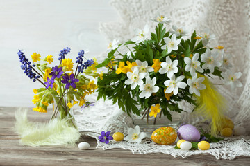 Easter flowers anemone, muscari and eggs on the table