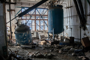 Fototapeta na wymiar The abandoned chemical pharmacy vitamin plant with the remains of equipment