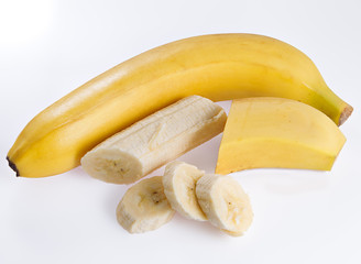 Bananas with slices on a white background.