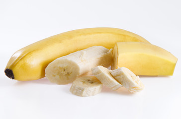 Bananas with slices on a white background.