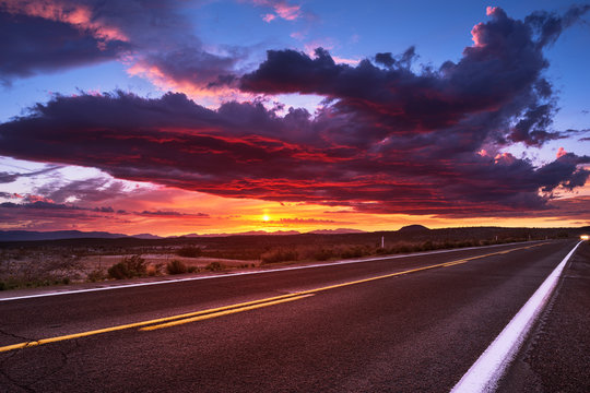 Fototapeta Sunset sky and road