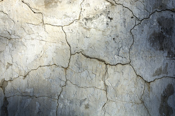 Old decaying wall in the dark cracks