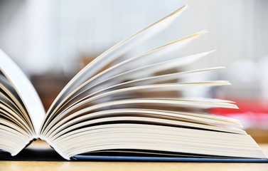 Hardcover book lying on the table in a library