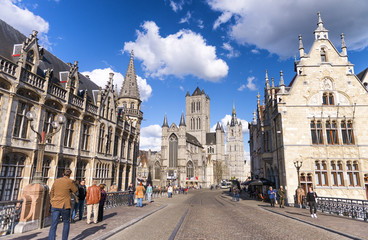 GENT, BELGIUM - MARCH 2015: Tourists visit ancient medieval city. Gent attracts more than 1 million people annually
