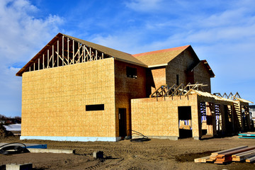 wood frame residential building under construction.