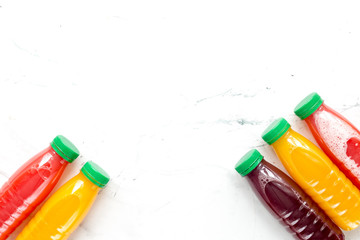 sweet drink in plastic bottles on white background top view mock up