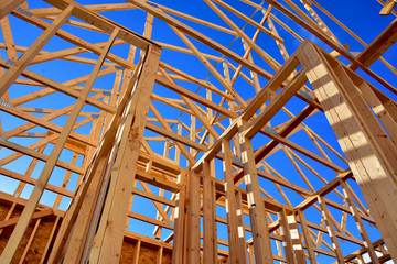 Wood frame residential structure under construction.
