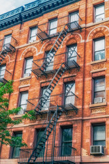 Obraz premium NEW YORK CITY, USA : Buildings and street life on the Manhattan. Manhattan described as the cultural and financial capital of the world and hosts the United Nations Headquarters.