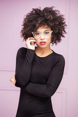 Girl with afro and eyeglasses.