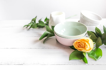 ceramic tableware with flowers on white background