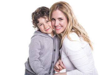 happy young mother with a child on light background